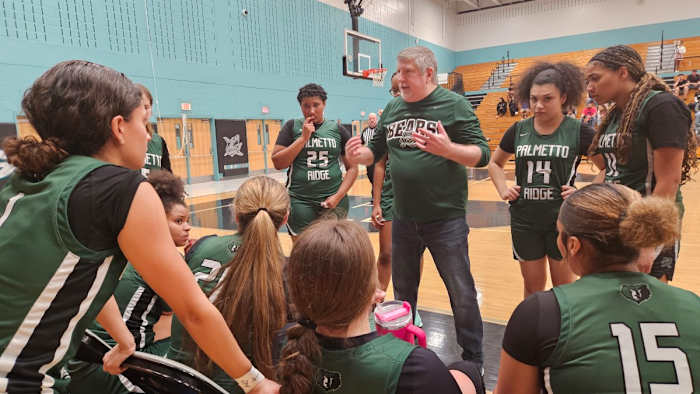 Palmetto Ridge head coach Ron Mosbach addresses Bears during a timeout in Saturday's Class 6A, District 12 championship game. Mosbach led Palmetto Ridge to the district final in his first season with the team.